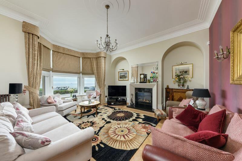 The living room features a stunning bay window which offers uninterrupted views of Cullercoats Bay.