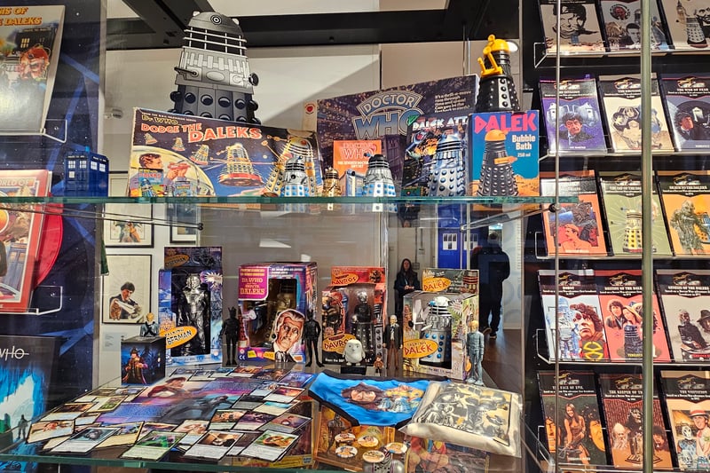 The exhibition includes a collection of memorabilia including games, figurines and Doctor Who Magic the Gathering cards.
