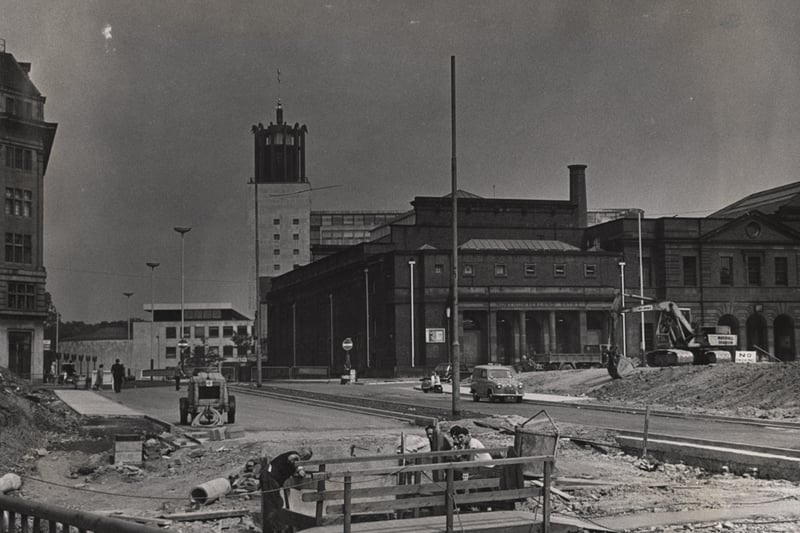The photograph shows the first completed section of the newly-created John Dobson Street. To the right of the picture is the Northumberland Baths and in the background is the Civic Centre.