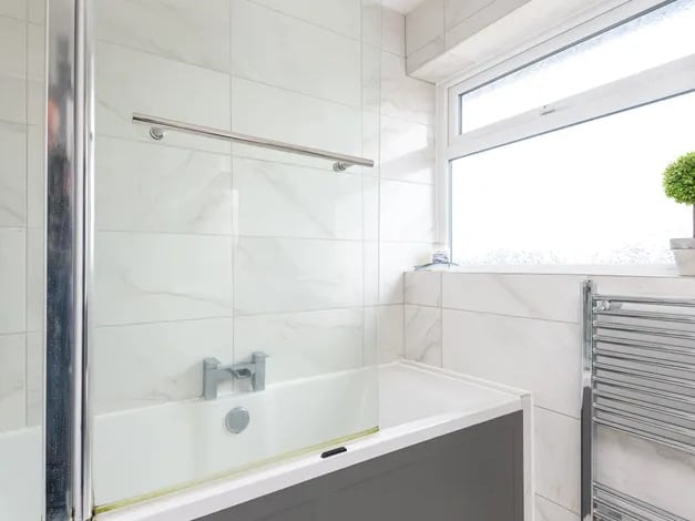 The first floor bathroom contains a shower/bath, toilet and sink. (Photo courtesy of Whitehornes Estate Agents)
