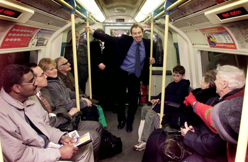 Britain's Prime Minister Tony Blair travels on the newly built Jubilee Line extension on the London Underground network, to the Millennium Dome in Greenwich, 
