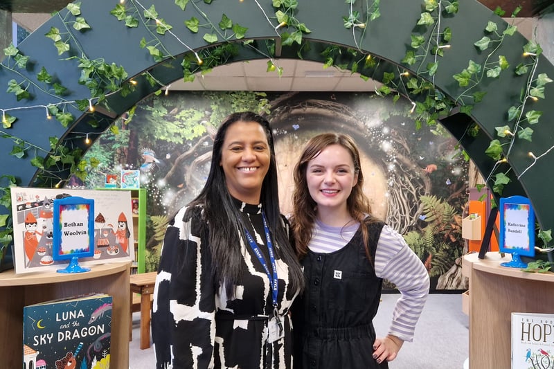 Principal Marie Elliott and author Bethan Woollvin. Bethan donated a framed image form one of her books with a handwritten note to help decorate the library.