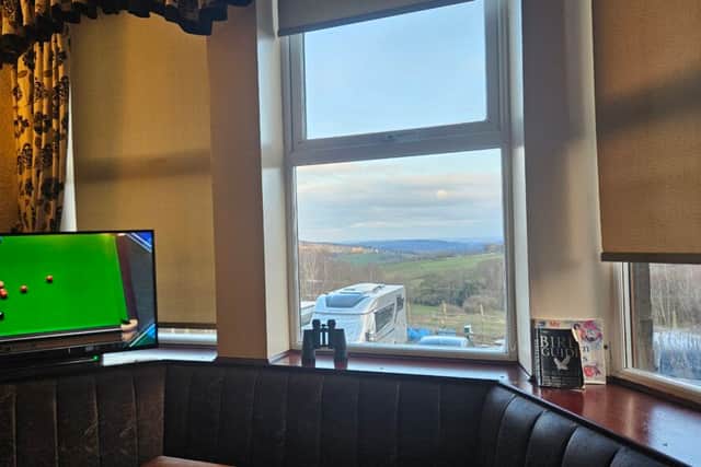 "A nice little feature is at the back of the pub. A window affords a breathtaking view over the Loxley Valley and has a pair of binoculars for customer use!"