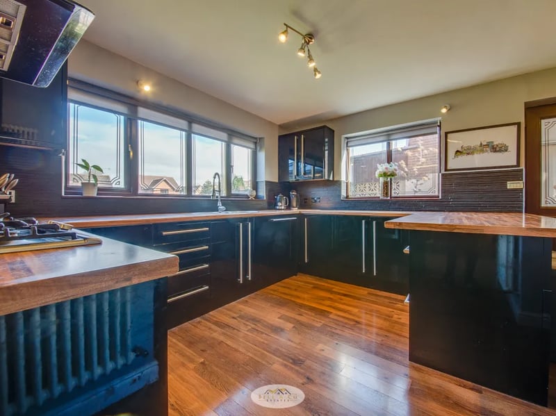 The large kitchen comes with a range of appliances and a breakfast bar. (Photo courtesy of Zoopla)