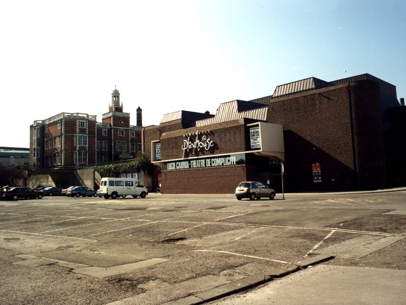 A photograph of the exterior of Newcastle Playhouse Barras Bridge Newcastle upon Tyne taken in 1995. There is a large car park in the foreground in front of the theatre. Newcastle University's Student Union can be seen in the background.