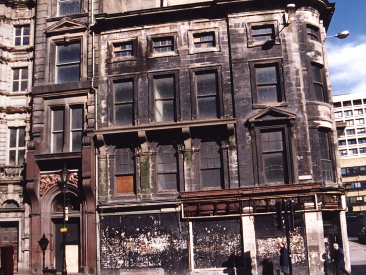 A view of a building on the corner of Grey Street/Mosley Street taken in 1995. The building is empty and derelict. It was formerly 'Amigos' restaurant. It's now the Grey Street Hotel and Leila Lily's.