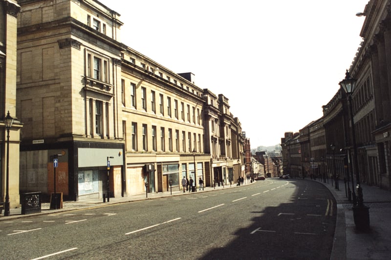A view of Grey Street Newcastle upon Tyne taken in 1995. The photograph is looking down Grey Street towards Mosley Street. High Bridge is in the foreground to the left. Buildings on Dean Street can be seen in the distance. 