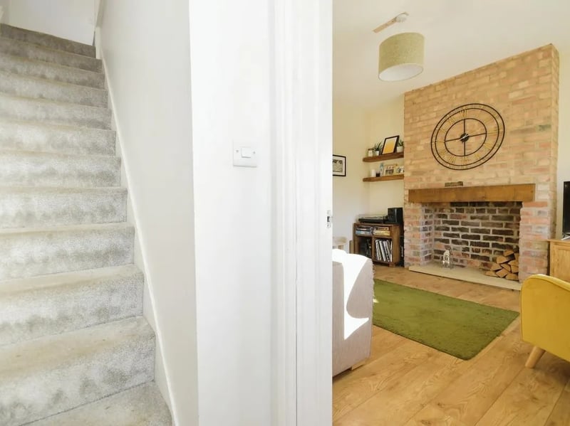 Just inside the front door, this hallway leads up to the first floor. (Photo courtesy of Zoopla)
