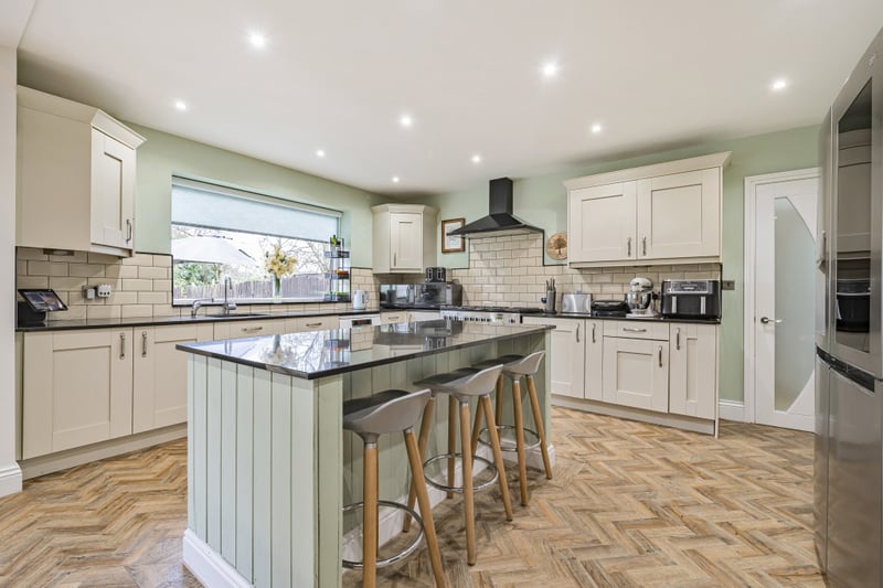 The modern kitchen offers granite worktops, space for an American style fridge/freezer, integrated dishwasher, stainless steel range cooker with stainless steel extractor fan.