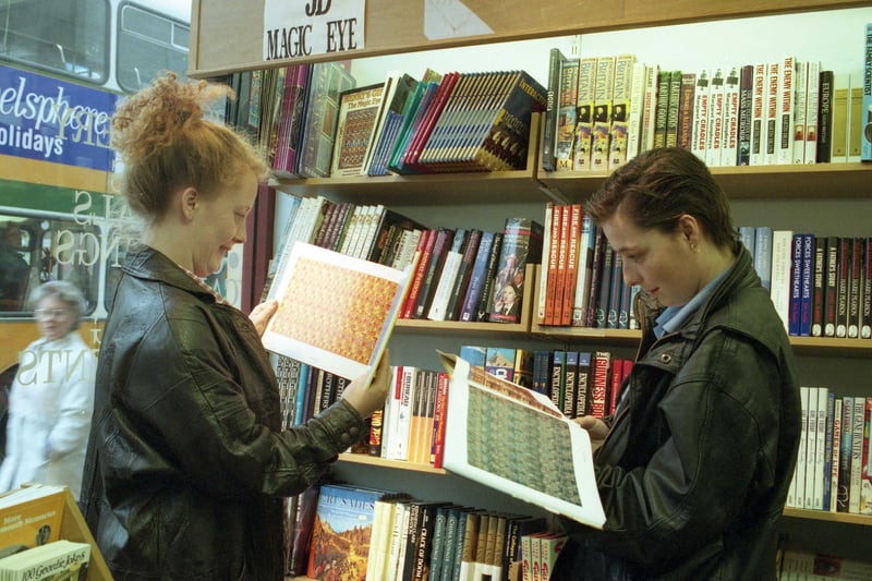 Angela and Janine Foster take a look at the magic eye images in a popular section of Hills Booksellers and Stationers, in 1994.