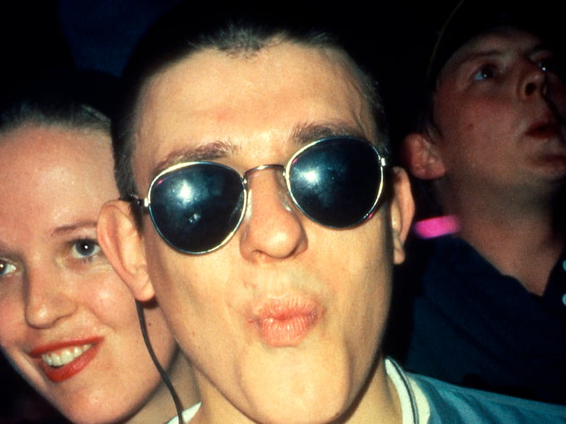 A clubber with sunglasses, gurning on the dancefloor of the Hacienda, 1988. 