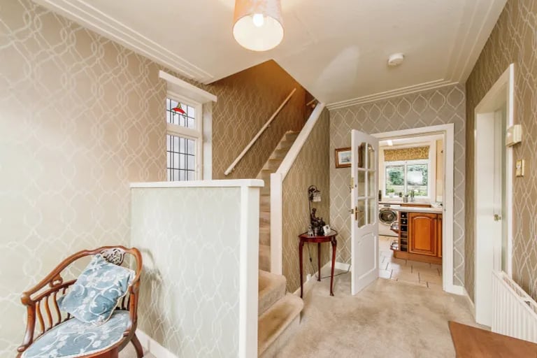 A large bright hallway with carpet gives access to the ground floor accommodation and stairs to the first floor.