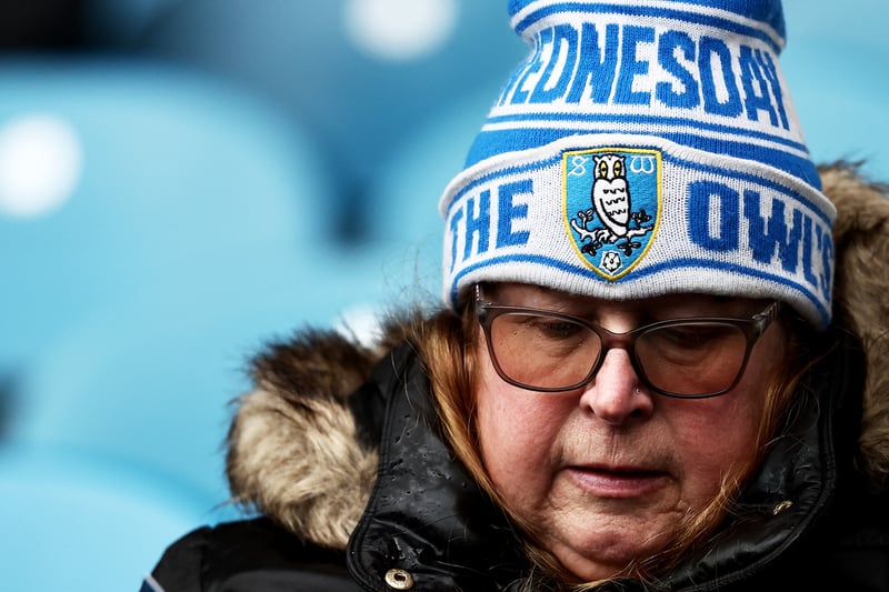 A fan reads the match day programme ahead of the Sky Bet Championship match between Sheffield Wednesday and Coventry City at Hillsborough.