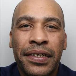 Iran Johnson, 45, is wanted by South Yorkshire Police in connection to an assault in Sheffield. 