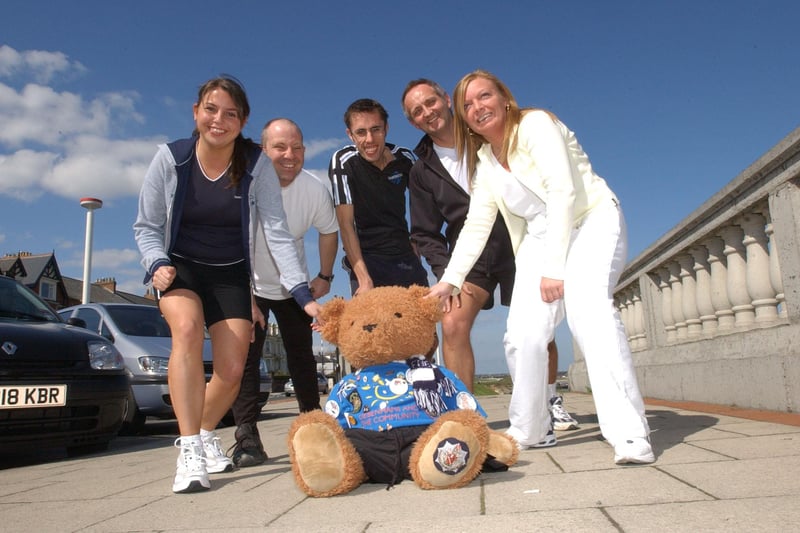 Staff members Julie Donneky, Jerry Cherrett, Paul Newby, John Turnbull and Jane Milner joined Toby the Bear at the start of their charity run from Roker to South Shields in 2004.