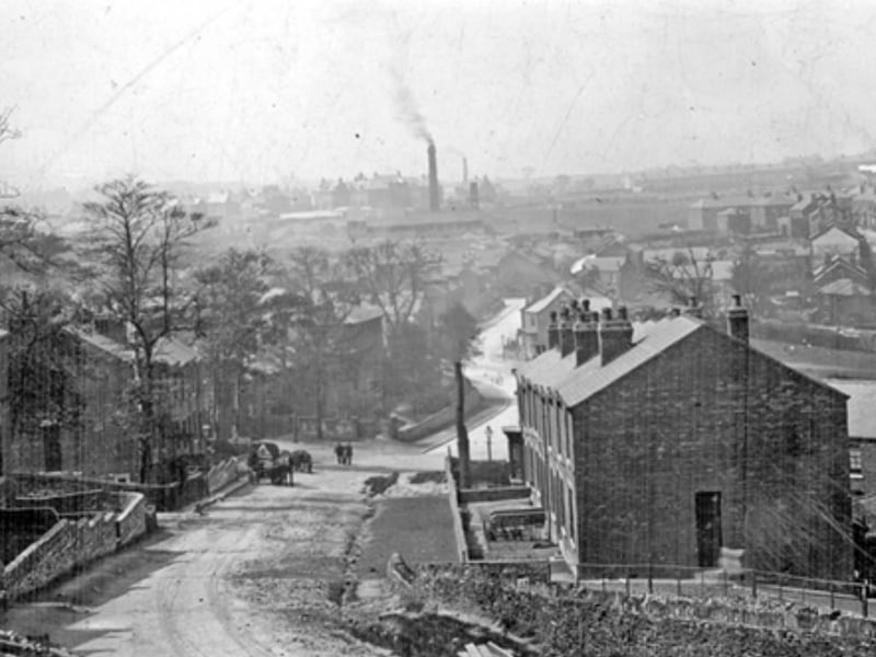 The view westward from Wincobank Hill when Jenkin Road had not been finished, showing Wincobank Hall in the trees below Hyacinth Road and the brickfields chimney in the background, some time during the 1940s or 50s
