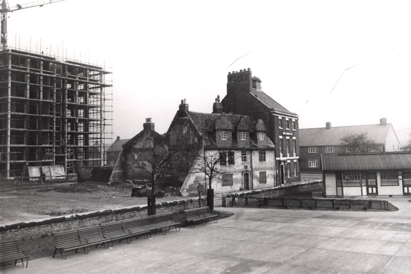 A view of Shieldfield Newcastle upon Tyne taken in 1960. The photograph shows a 17th century house on the north side of Shieldfield Green. The King Charles Tower multi-storey block of flats are being built to the left of the house