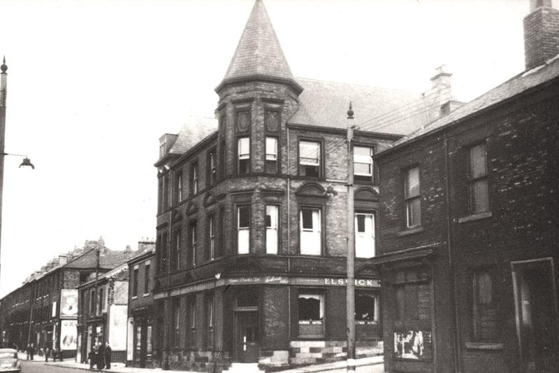  The Elswick Hotel on Scotswood Road the houses on either side of the pub can be seen.