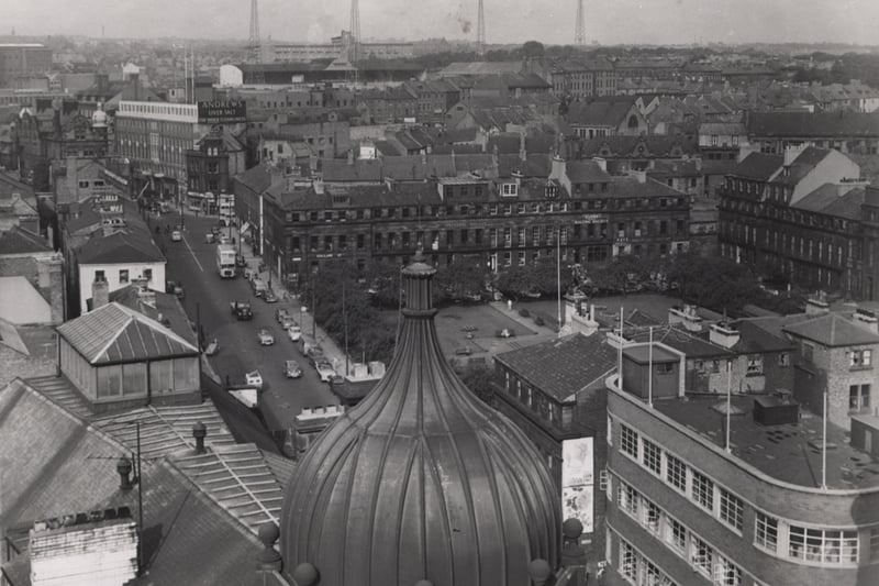 This is an aerial view of Blackett street in 1960. Eldon Square can be seen on the right. St. James' Park can be viewed in the distance. 