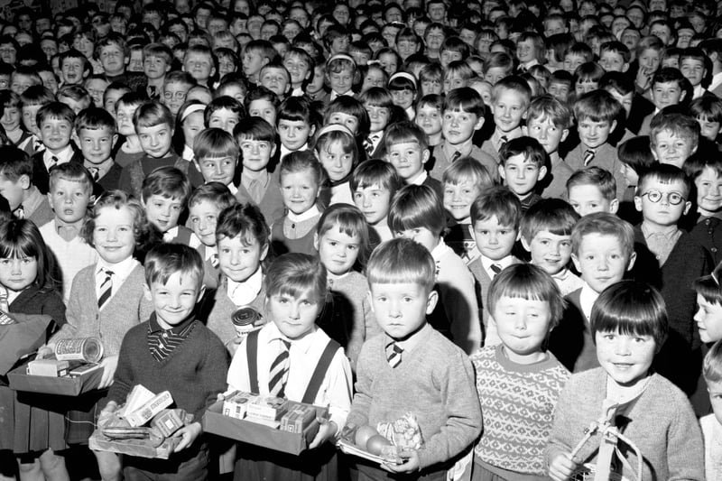 Children bring their offerings to the Harvest Festival service at Gracemount primary school, Edinburgh,  in October 1968.