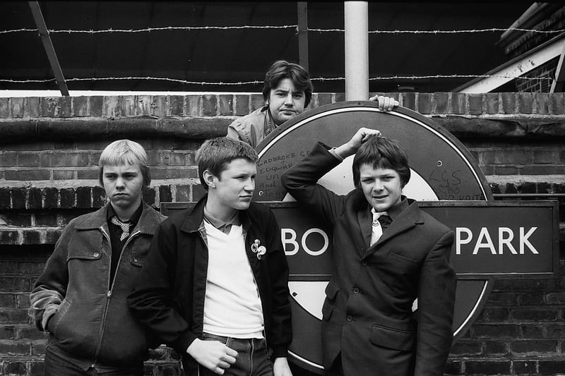 Four friends with Westbourne park tube station sign in 1980. UK 1980. (Photo by Mark Charnock/PYMCA/Avalon/Getty Images)