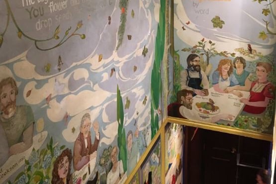 You can find the Alasdair Gray mural along the stairs at the back of The Chip's Courtyard Restaurant.