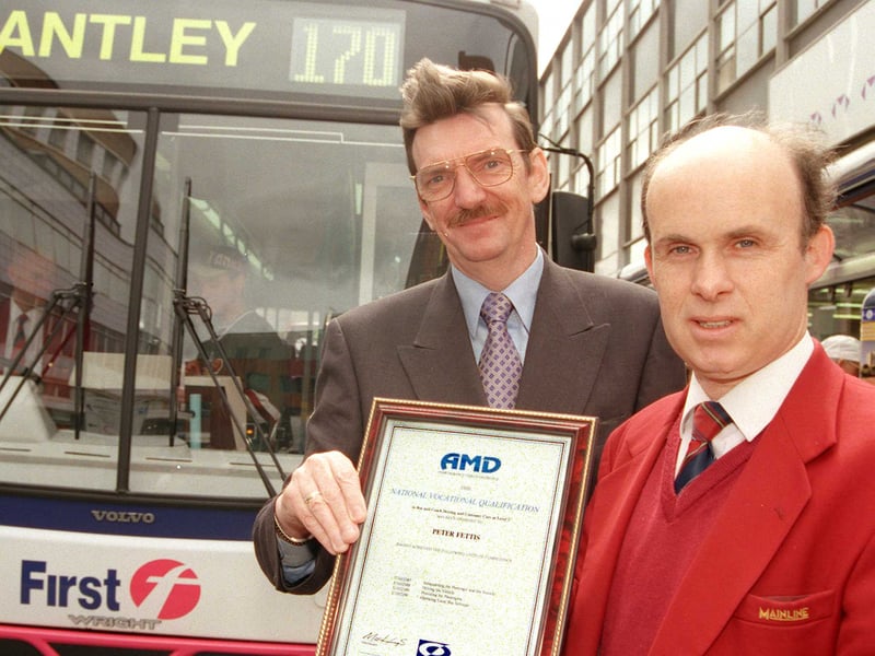 First Mainline bus driver Peter Fettis receives his certificate from the company's Doncaster director and general manager John Swann in 1999