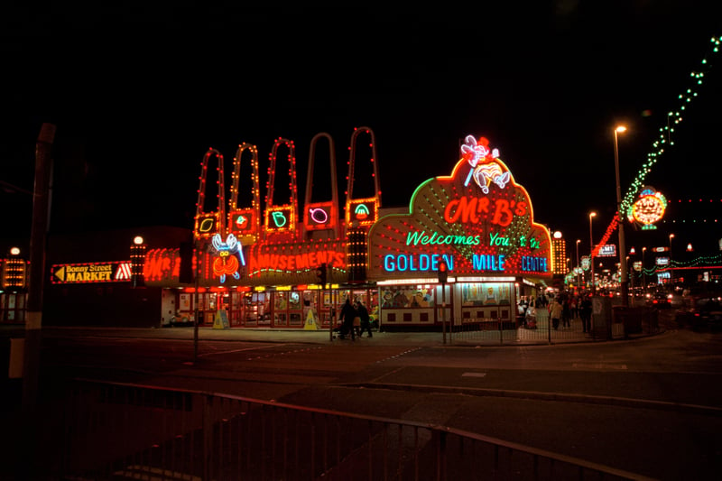 Illuminated amusement arcades, Blackpool, 1999. Mr B's Golden Mile Centre amusement arcade is shown at night. Blackpool is famous for its illuminations, which started in 1879 with electric arc lamps lighting up the promenade. There are now five miles of illuminations from early September to early November