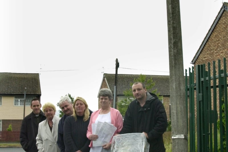 Members of the Manor Farm Residents Association at the bus stop in Manor Farm Grove which was not in use. Pictured in July 2001 are Jonathan Goode, curator at St Mary's Church, Middleton,  Anne McAndrew, John Kaye, Alison Walker, Coral Kaye and Christ Horton. 