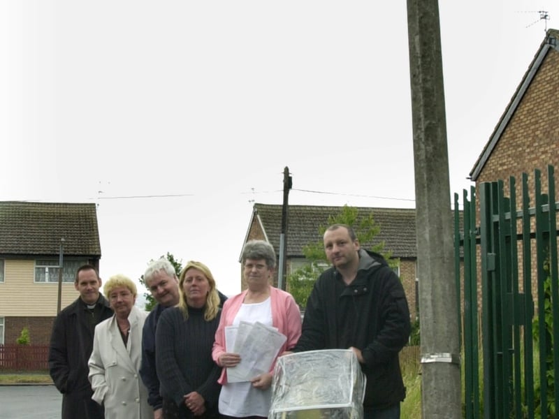 Members of the Manor Farm Residents Association at the bus stop in Manor Farm Grove which was not in use. Pictured in July 2001 are Jonathan Goode, curator at St Mary's Church, Middleton, Anne McAndrew, John Kaye, Alison Walker, Coral Kaye and Christ Horton.