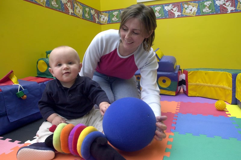 The opening of the South Leeds Family Learning Centre in September 2001. Pictured is child care assistant Debbie Morton with nine-month-old Harry Colley.