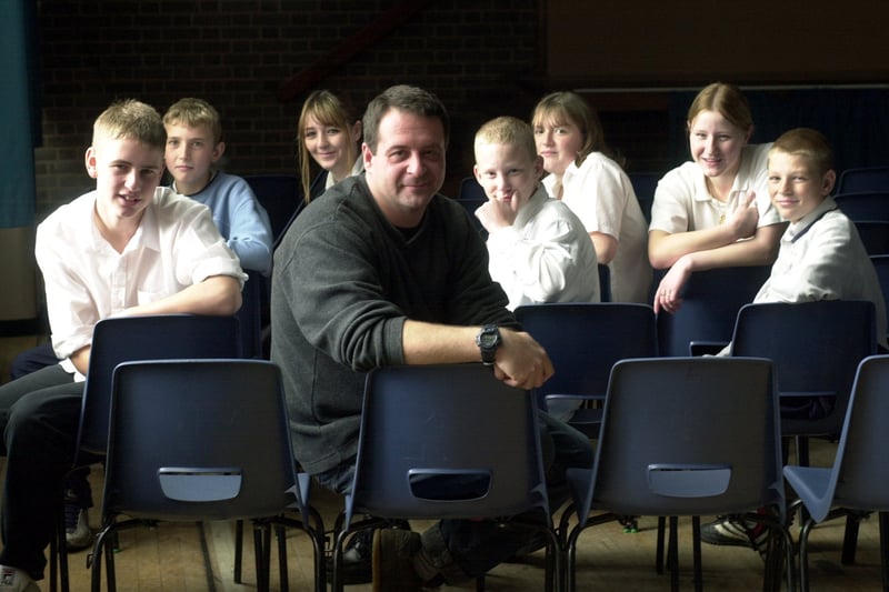 Comedian Mark Thomas with drama students while visiting Merlyn Rees Community High School in October 2001.