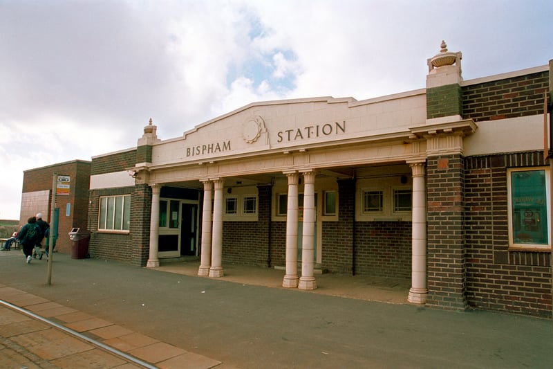 Bispham Station, 1999. The facade of the station with the tram lines are shown on a slightly overcast day. To the left are two figures walking away