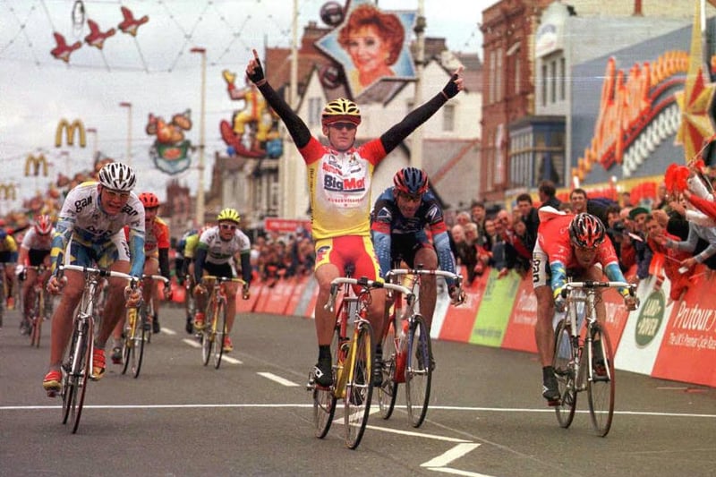 Australian cyclist Jay Sweet from the BigMat team raises his arms as he crosses the finish line in Blackpool 26 May winning the Prutour race