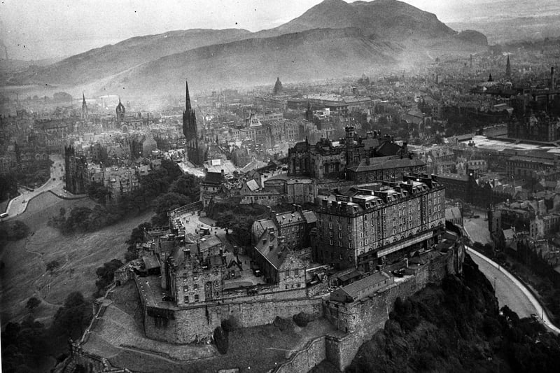 Aerial shot of the centre of Edinburgh with Edinburgh Castle and Arthur's Seat - with smog over the city. This photo was taken in August 1952.