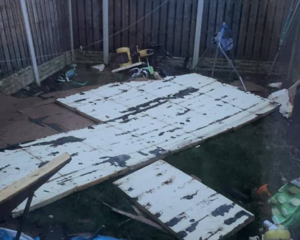 Roofing which was torn off a row of maisonettes on Haslam Crescent in Lowedges, Sheffield, during Storm Jocelyn and landed in Kerrie Ibbotson's garden, smashing her children's swing