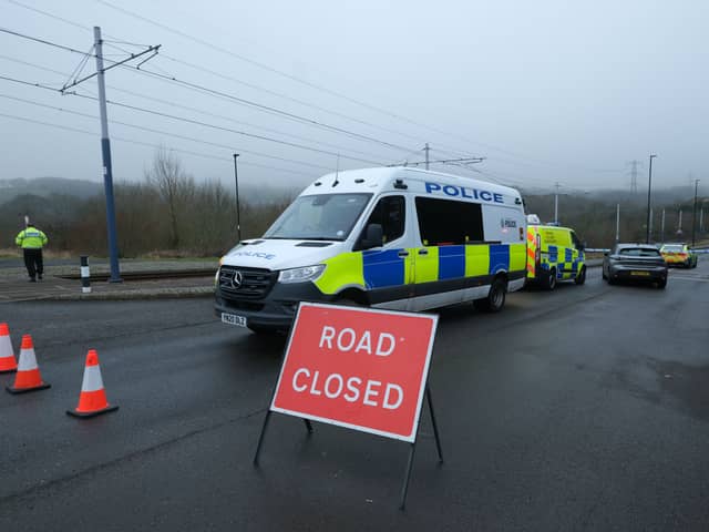Picture shows the scene at Donetsk Way, Sheffield, today, after the road was closed by police after a pedestrian was seriously injured in a collision