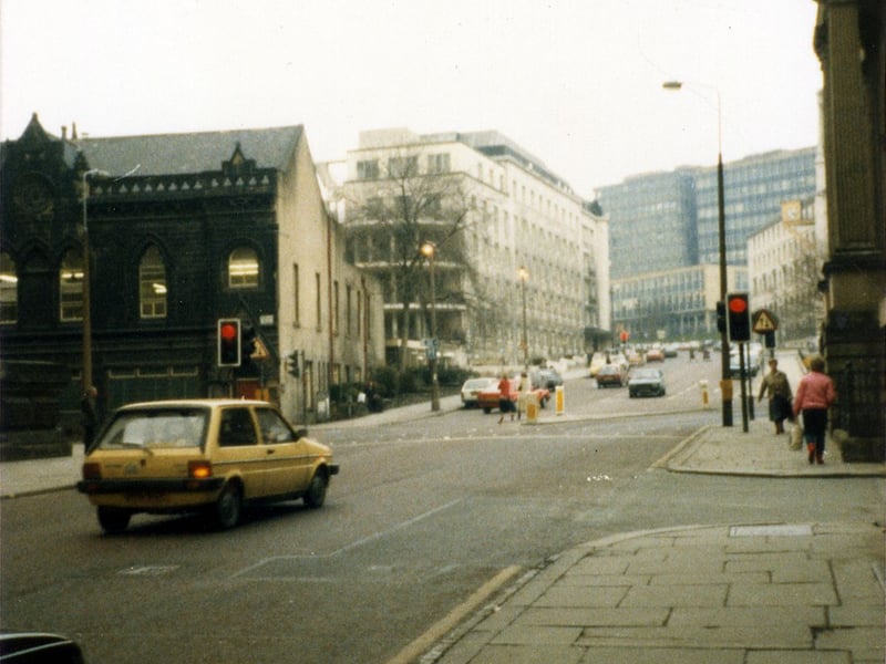 Looking north up Calverley Street showing the junction with Alexander Street on the right. Just beyond this, the edge of the Education Offices can be seen. In the background are the Brotherton Wing of Leeds General Infirmary and buildings of Leeds Polytechnic.