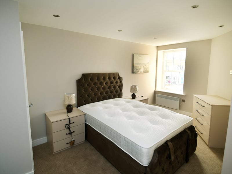 The upper floors have been transformed into three two-bedroom duplex apartments