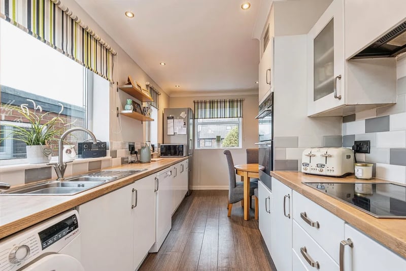 The home features a beautiful  and spacious kitchen with lots of work space and a range of modern appliances.