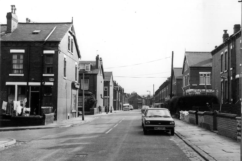 Looking south along Bude Road towards Trentham Street in the distance. On the left is the junction with Clovelly Terrace, then moving back, Stratford Street, Back Stratford Terrace and Stratford Terrace lead off to both left and right. A corner shop. Satwant Virdee's Fancy Cloth House, is seen to the right. Pictured in August 1983.
