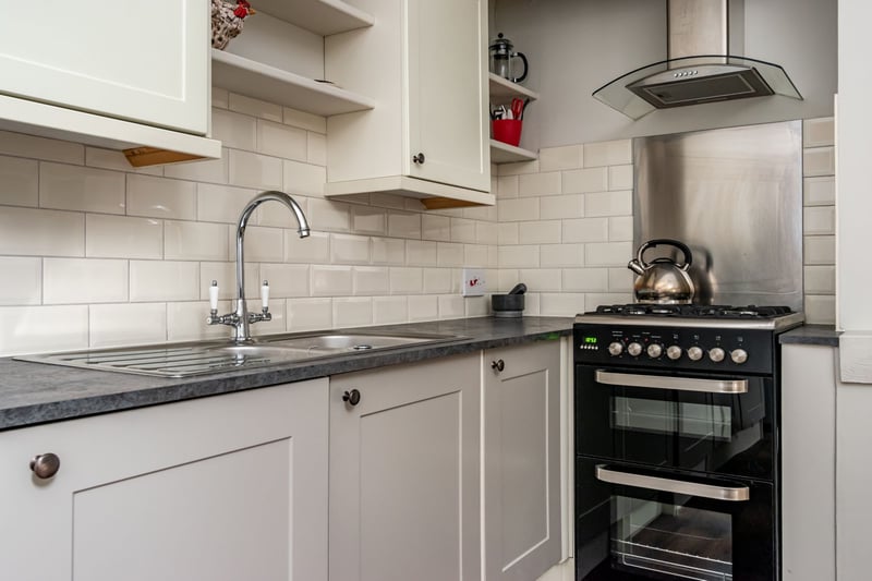 The kitchen is fitted with a range of floor and wall mounted units, integrated appliances and a gas hob and electric oven which is included in the sale.
