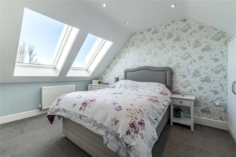 On the second floor is a double bedroom with skylights and ensuite bathroom.