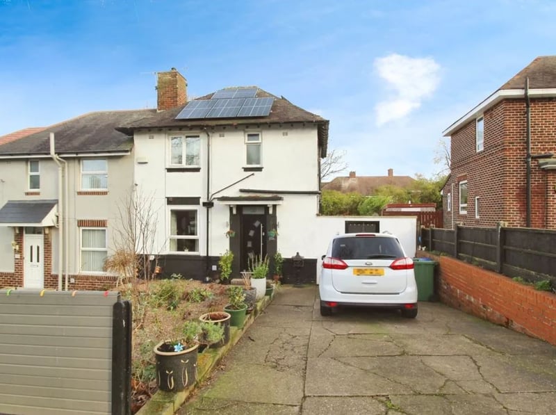 The driveway of the three-bedroom semi-detached house on Follett Road, Sheffield, which is for sale with an asking price of £180,000