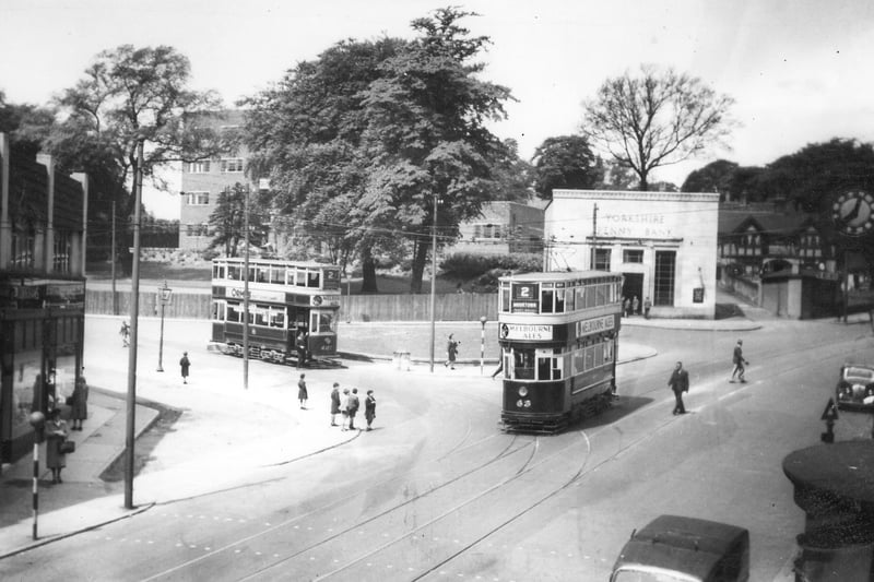 Harrogate Road by the junction with Stainbeck Lane, known as Stainbeck Corner. The Yorkshire Penny Bank is towards the right. Two trams are seen on the road : nos.407 (left) and 63 (right), both Chamberlains bound for Moortown. Pictured in May 1948.