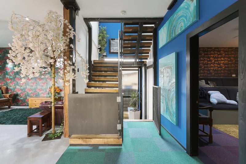 This central landing on the first floor provides access to the ground floor, second floor and cinema room. (Photo courtesy of Zoopla)