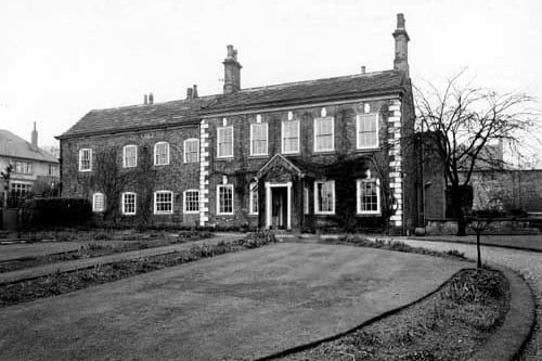Looking north at Clough House on Stainbeck Lane. The large brick-built house has lawns and a long driveway 
 - this property is now The Mustard Pot pub. Pictured in January 1949.