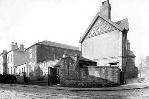 The junction of Woodland Lane and Hawthorn Mount in February 1940. The buildings to the left with the spiral fire escape are part of Hawthorn House, a Grade II listed building dating from the early 19th century, which was occupied by the Leeds Charity School, also known as St. John's Home, between the 1890s and 1924; in 1911 there were 26 girls living there with a matron called Mary Slater.