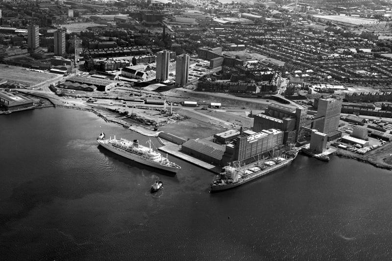 Aerial photo of tugs guiding a cruise liner into Leith docks  Edinburgh in August 1978.