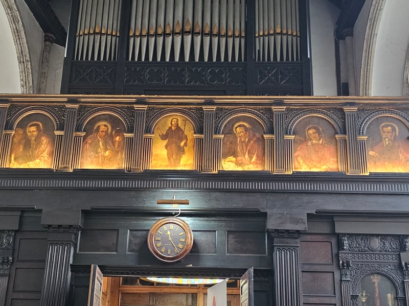 The west gallery, dating from the 17th century, was moved back by one bay in 1883 when the current organ, by Vowles of Bristol, replaced an earlier instrument of 1843, and features paintings of seven apostles, with St John the Baptist occupying the central position.
